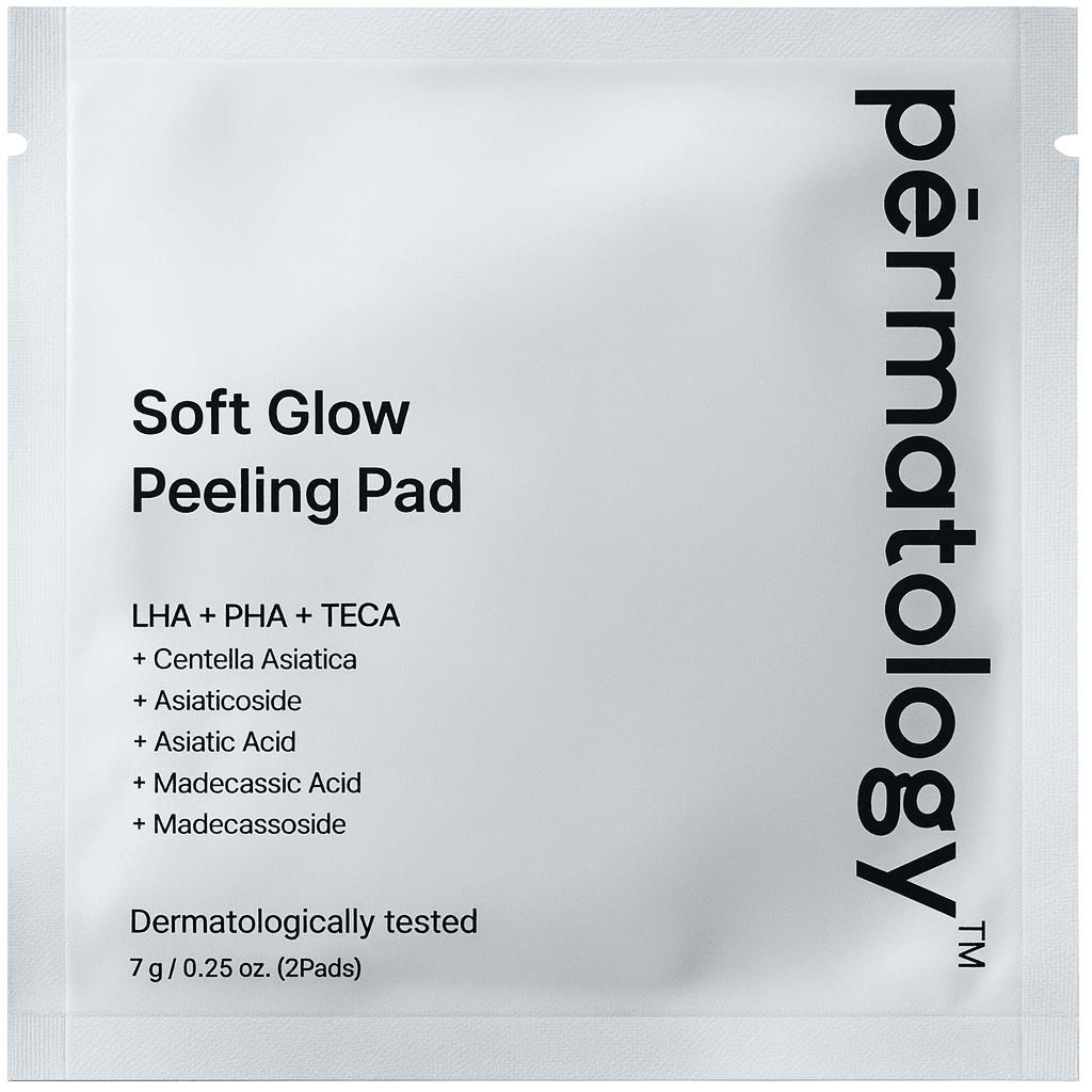 Square white packet labeled "permatology" on the right edge; front text reads "Soft Glow Peeling Pad" with a short ingredients list and product details in small black type. Minimal, clinical packaging photographed on a plain white background.